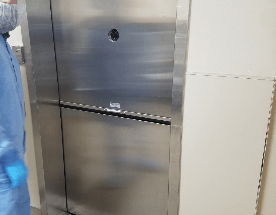 Stainless steel commercial dumbwaiter installed in a medical or laboratory environment