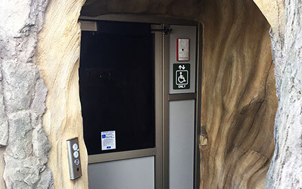 Genesis shaftway model vertical platform lift for wheelchairs built inside a fake tree