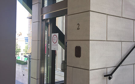Genesis shaftway model vertical platform lift for wheelchairs in the lobby of a nice building