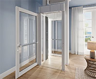 Woman entering the LUMA Homelift in a stylish living room, showcasing its compact and elegant design